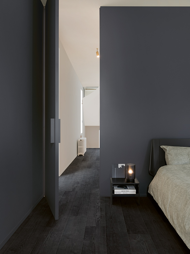 Dark laminate flooring in dark bedroom